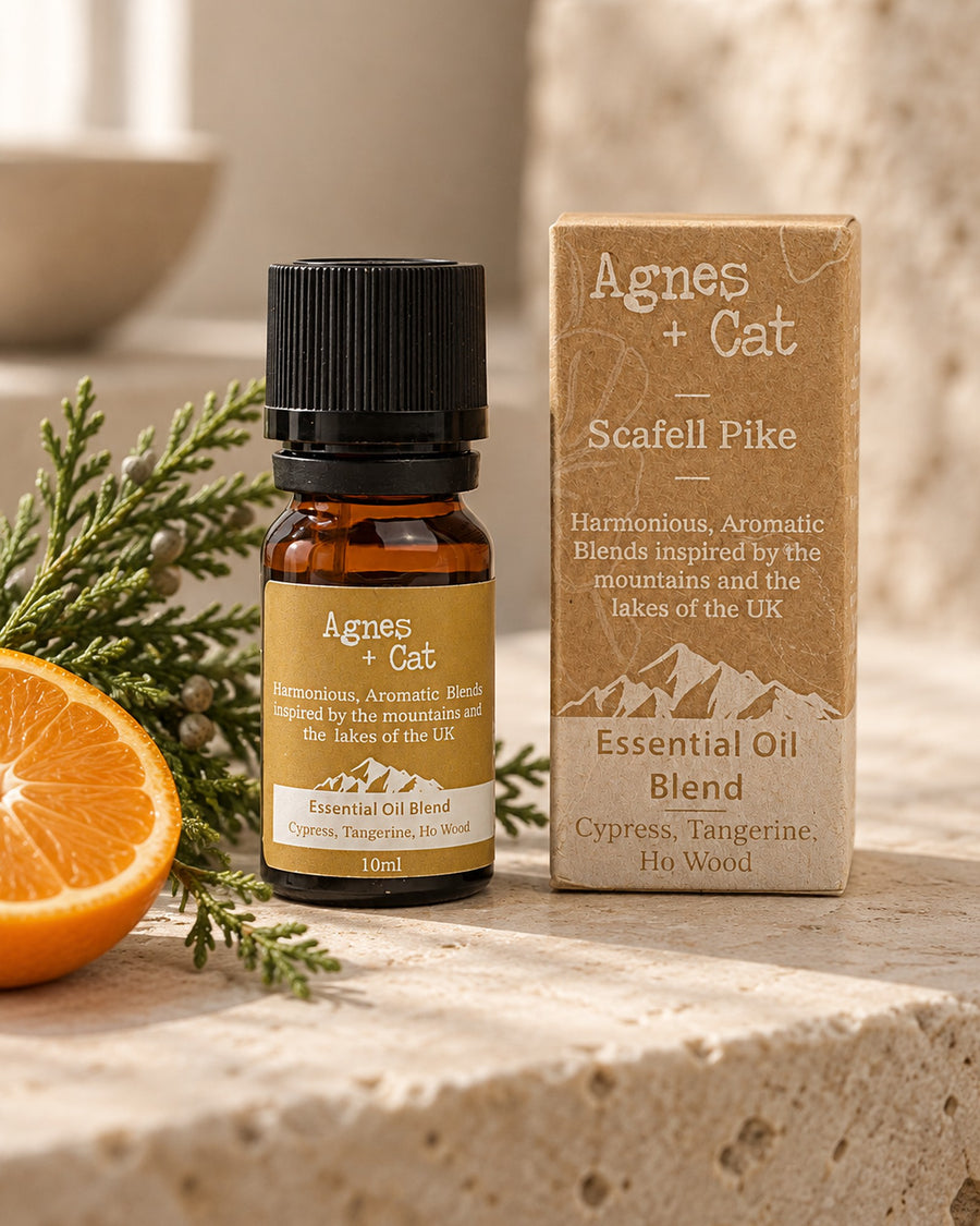 Agnes + Cat Scafell Pike Essential Oil Blend, Cypress, Tangerine and Ho Wood, 10ml styled in a calm spa setting, Tara Spa Yarm