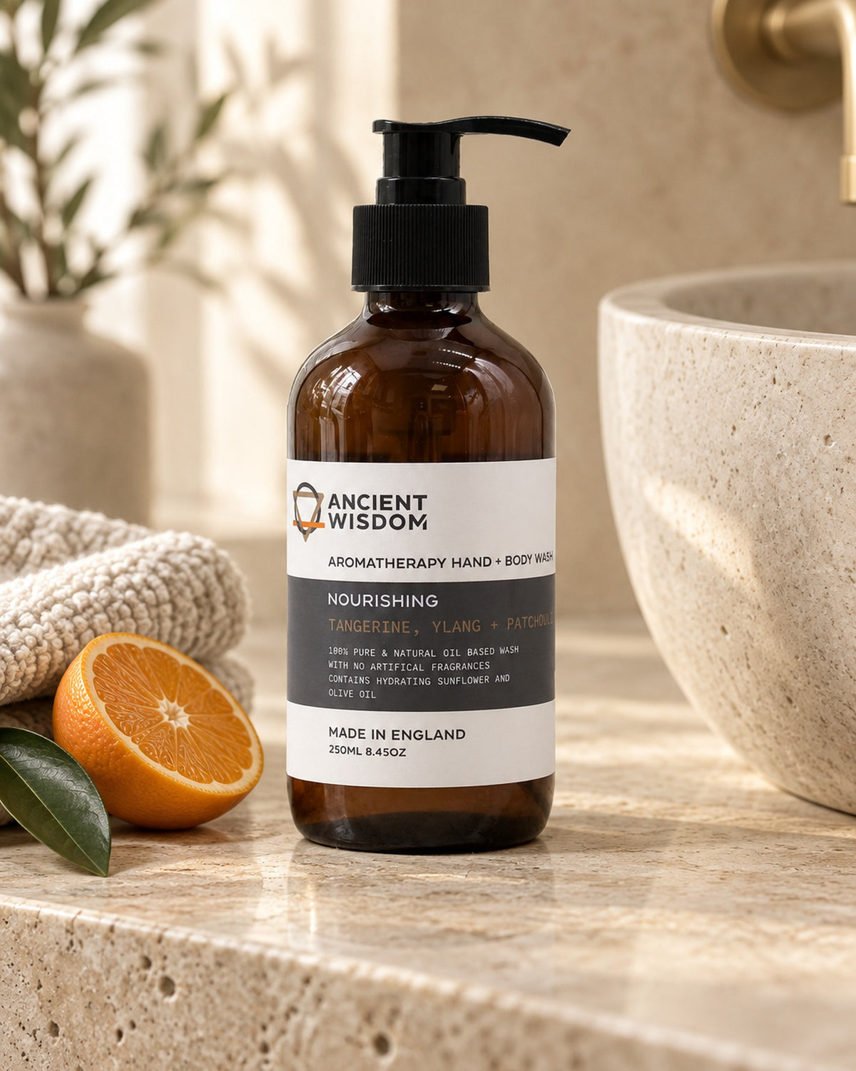 Tangerine, Ylang and Patchouli Hand and Body Wash, 250ml styled in a calm spa setting, Tara Spa Yarm