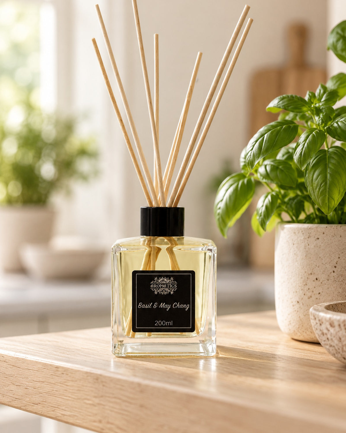 Basil and May Chang Essential Oil Reed Diffuser, 200ml styled in a calm spa setting, Tara Spa Yarm