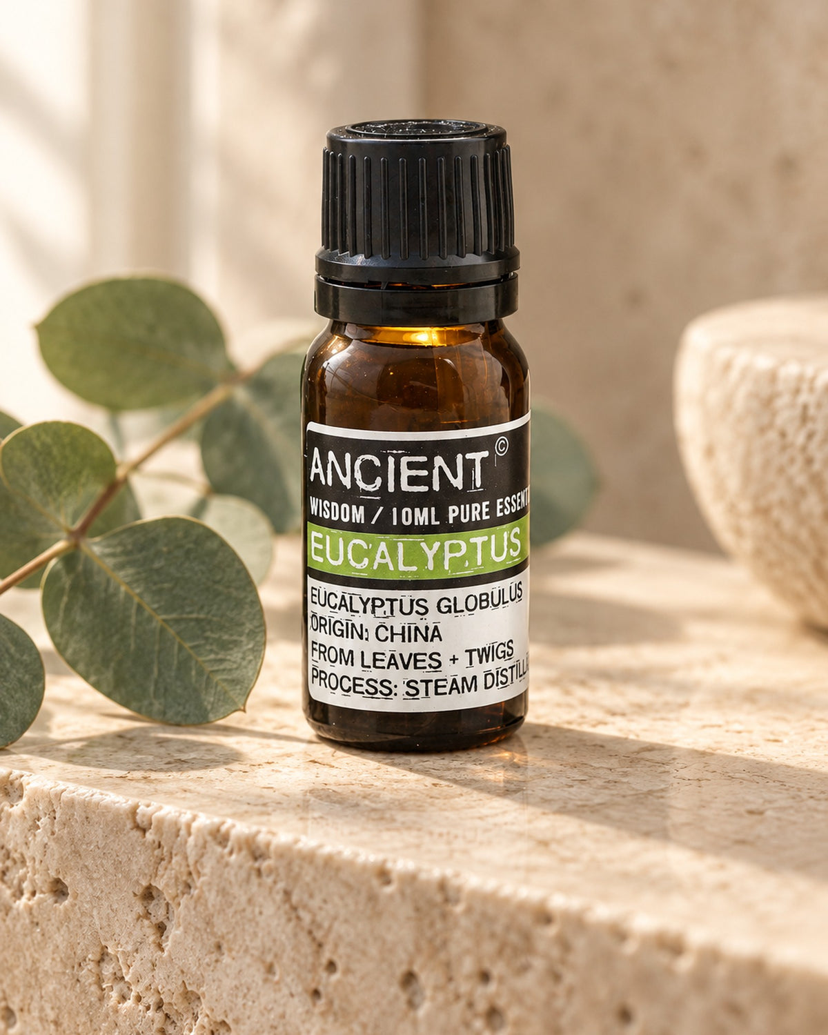 Eucalyptus Essential Oil, 10ml styled in a calm spa setting, Tara Spa Yarm