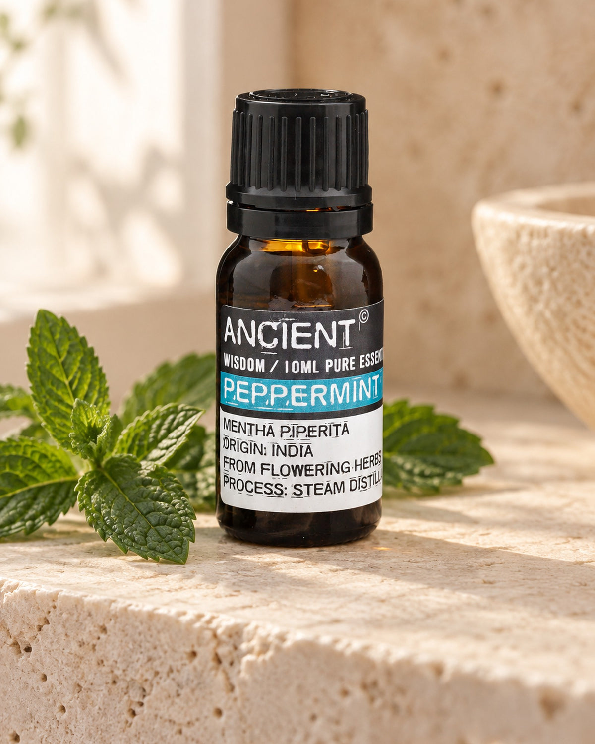 Peppermint Essential Oil, 10ml styled in a calm spa setting, Tara Spa Yarm