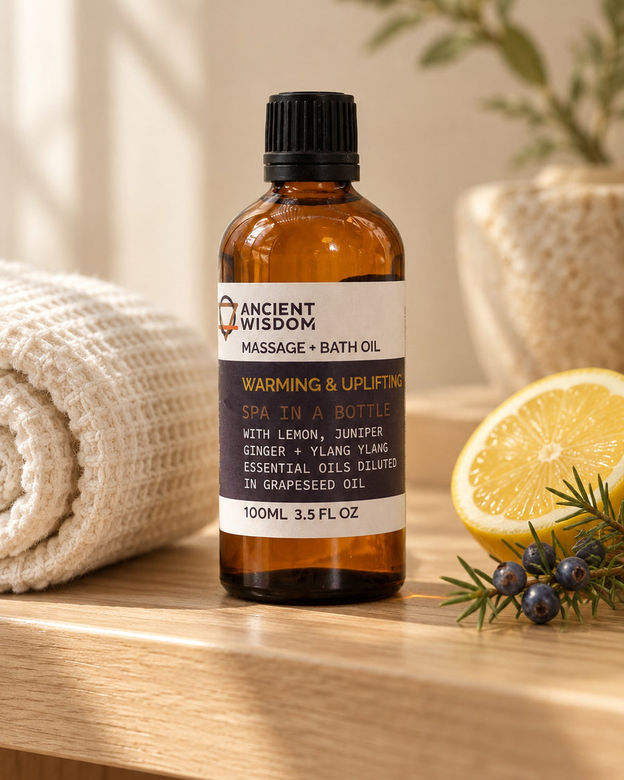 Massage Oil with Lemon, Juniper, Ginger and Ylang Ylang, 100ml styled in a calm spa setting, Tara Spa Yarm