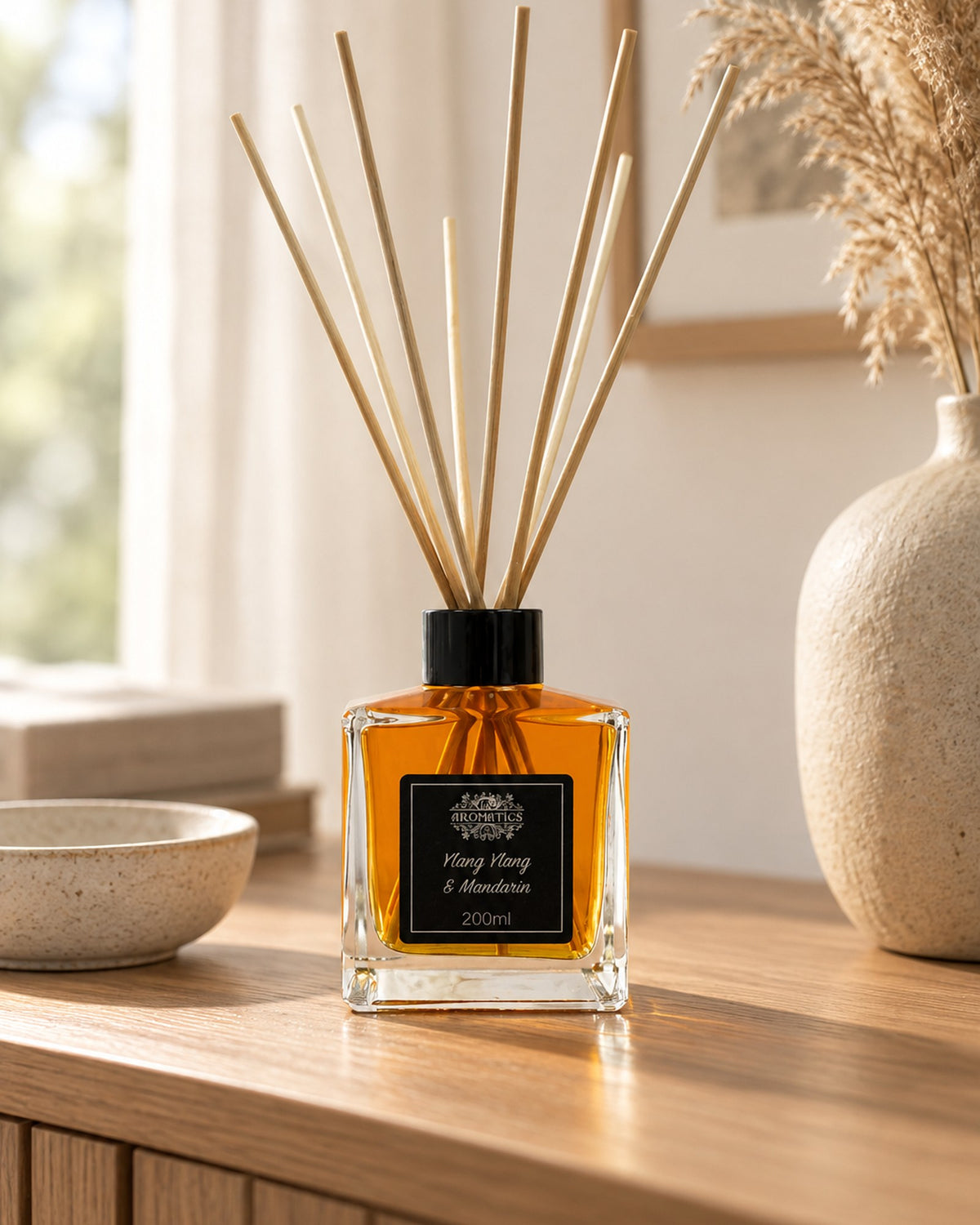 Ylang Ylang and Mandarin Essential Oil Reed Diffuser, 200ml styled in a calm spa setting, Tara Spa Yarm
